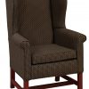 Dark Upholstered Arm Chair With Cherry Legs