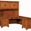 wooden corner desk with overhead cabinets