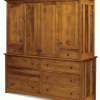 light brown wooden cabinet with multiple doors and drawers