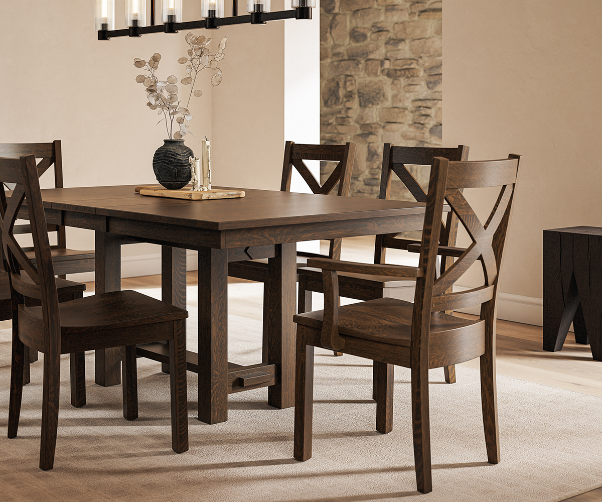 Amish solid wood dining table with matching chairs in warm, modern farmhouse dining room.